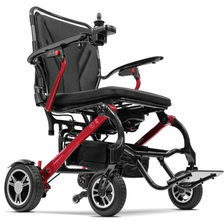Forcemech Carbon F1 Lightweight Folding Power Wheelchair in red shown from a lower angle highlighting the frame wheels and footrest.